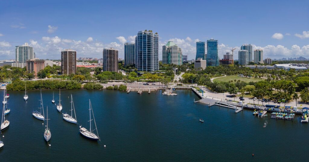 Coconut Grove waterfront with sailboats, bayfront park and condo towers