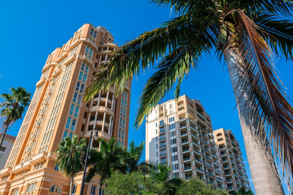 Mediterranean-style condo towers and palm trees in Coral Gables