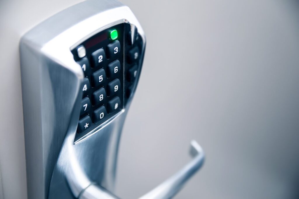 Electronic keypad smart lock with lever handle installed on a door